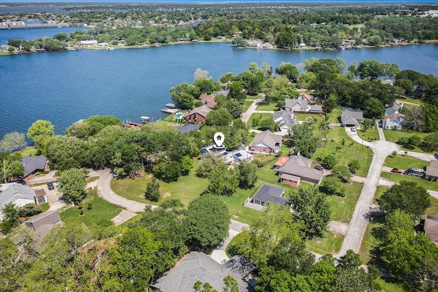 13365 Hawthorne Dr, Willis, TX 77318 - aerial overview of property's location with nearby suburban area and a nearby body of water