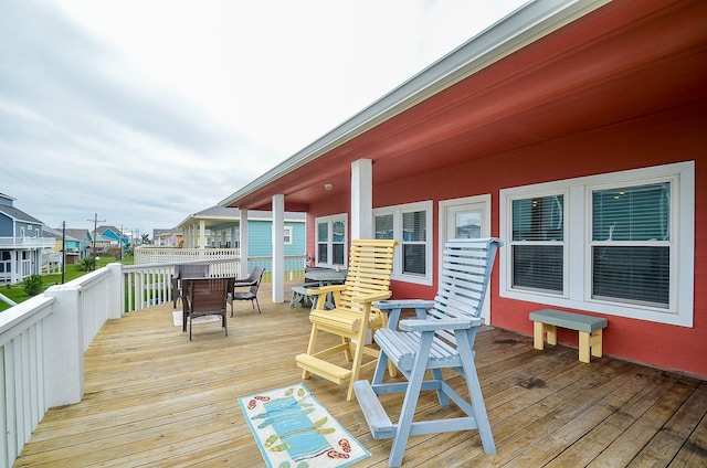 3346 Pirates Cv, Crystal Beach, TX 77650 - wooden deck with outdoor dining area