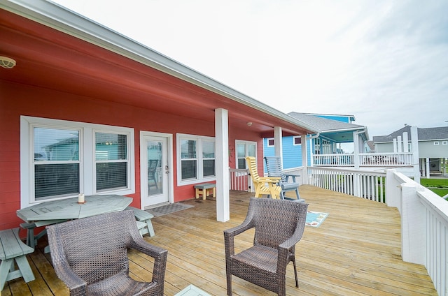 3346 Pirates Cv, Crystal Beach, TX 77650 - wooden deck with outdoor dining area
