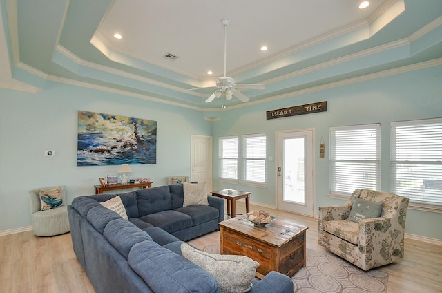 3346 Pirates Cv, Crystal Beach, TX 77650 - living room with a tray ceiling, visible vents, and plenty of natural light