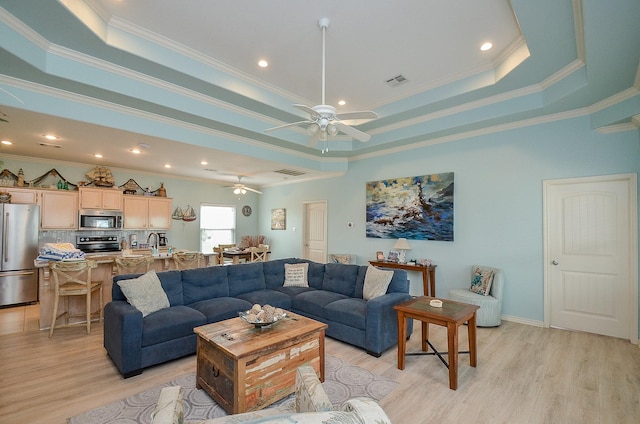 3346 Pirates Cv, Crystal Beach, TX 77650 - living area with a raised ceiling, visible vents, and crown molding
