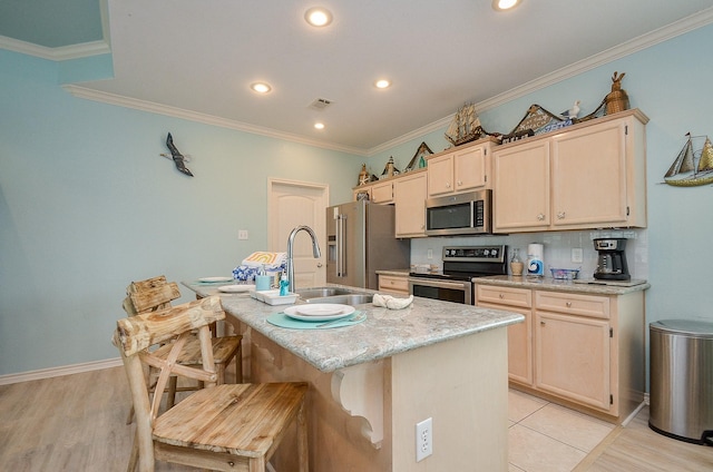 3346 Pirates Cv, Crystal Beach, TX 77650 - kitchen featuring a kitchen bar, ornamental molding, appliances with stainless steel finishes, and visible vents