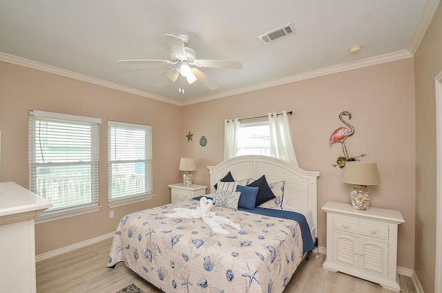 3346 Pirates Cv, Crystal Beach, TX 77650 - bedroom featuring light wood-type flooring, visible vents, baseboards, and ornamental molding