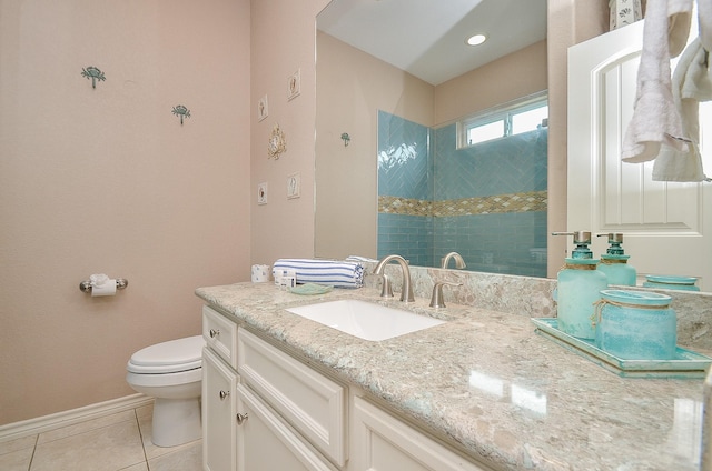 3346 Pirates Cv, Crystal Beach, TX 77650 - bathroom featuring tiled shower, toilet, baseboards, tile patterned flooring, and vanity