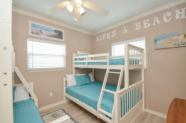 3346 Pirates Cv, Crystal Beach, TX 77650 - bedroom featuring ceiling fan, baseboards, crown molding, and wood finished floors