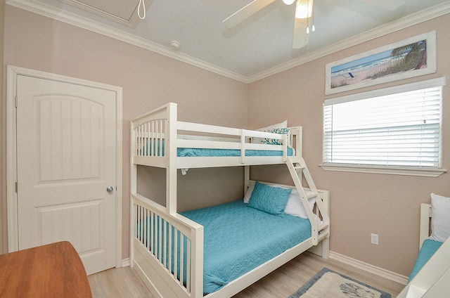 3346 Pirates Cv, Crystal Beach, TX 77650 - bedroom featuring a ceiling fan, baseboards, ornamental molding, and wood finished floors