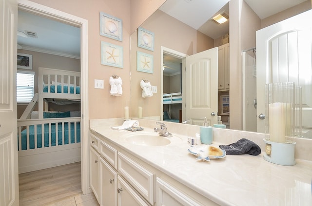 3346 Pirates Cv, Crystal Beach, TX 77650 - full bath featuring a shower, crown molding, vanity, and visible vents