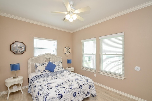 3346 Pirates Cv, Crystal Beach, TX 77650 - bedroom with light wood finished floors, baseboards, and multiple windows