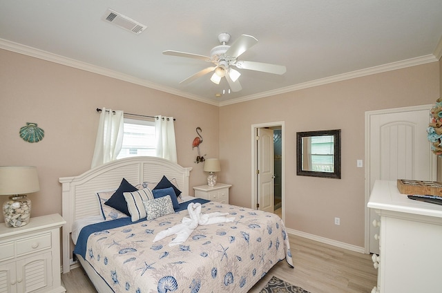 3346 Pirates Cv, Crystal Beach, TX 77650 - bedroom featuring baseboards, ornamental molding, visible vents, and light wood-style flooring