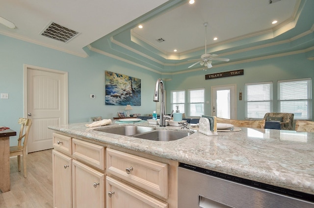 3346 Pirates Cv, Crystal Beach, TX 77650 - kitchen featuring visible vents, a sink, ornamental molding, and a tray ceiling