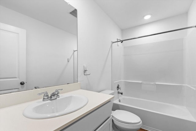 bathroom with washtub / shower combination, visible vents, toilet, and vanity