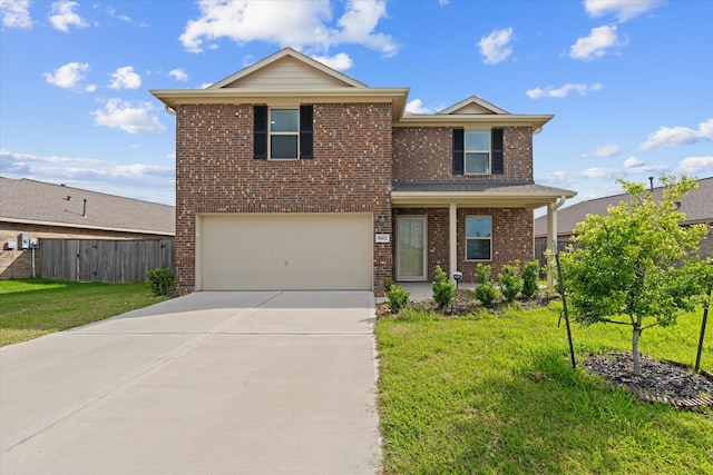 traditional-style home featuring concrete driveway, an attached garage, fence, a front yard, and brick siding