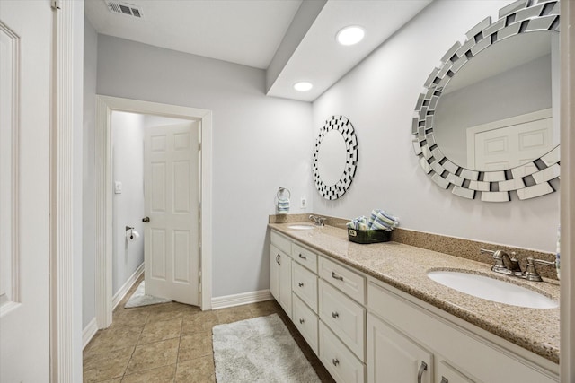 12692 Briar Patch Rd, Houston, TX 77077 - bathroom with visible vents, a sink, recessed lighting, and double vanity
