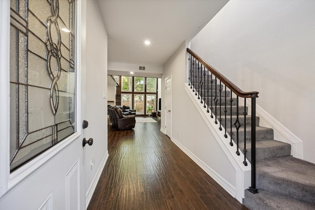 12692 Briar Patch Rd, Houston, TX 77077 - entryway with dark wood finished floors, visible vents, baseboards, recessed lighting, and stairway