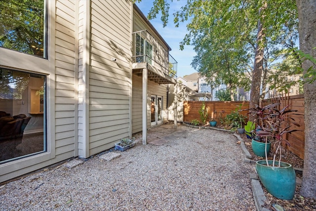 12692 Briar Patch Rd, Houston, TX 77077 - view of yard featuring a fenced backyard, a patio, and a balcony