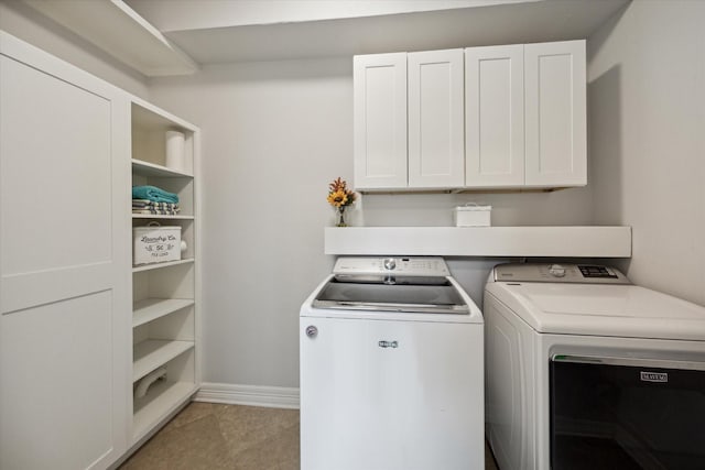 12692 Briar Patch Rd, Houston, TX 77077 - laundry room featuring cabinet space, independent washer and dryer, and baseboards