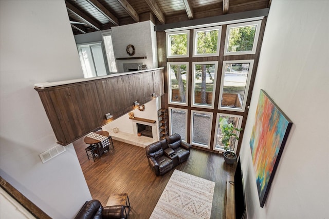 12692 Briar Patch Rd, Houston, TX 77077 - living room featuring wooden ceiling, beamed ceiling, wood finished floors, and visible vents
