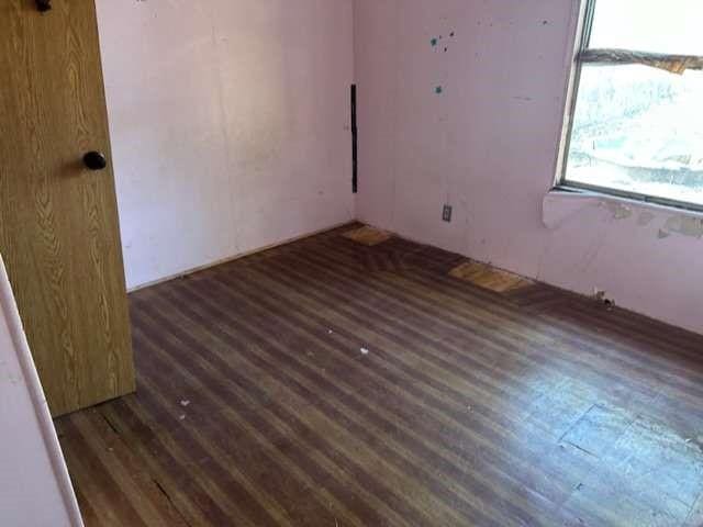 unfurnished room featuring wood finished floors