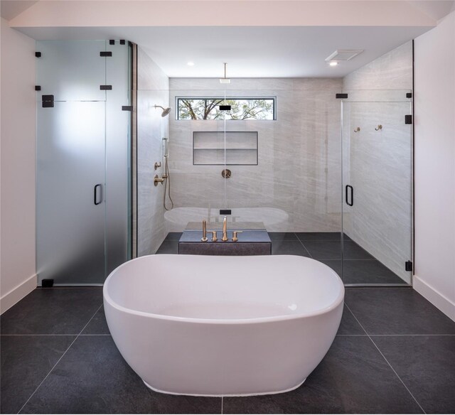 2239 Colquitt St, Houston, TX 77098 - full bathroom with baseboards, a shower stall, and tile patterned flooring