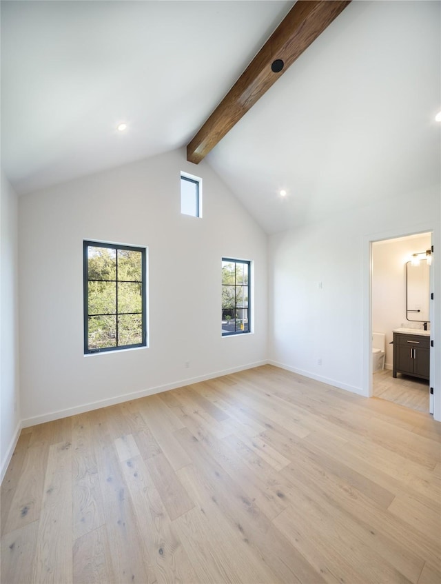2239 Colquitt St, Houston, TX 77098 - unfurnished living room with recessed lighting, beamed ceiling, baseboards, and light wood-style floors