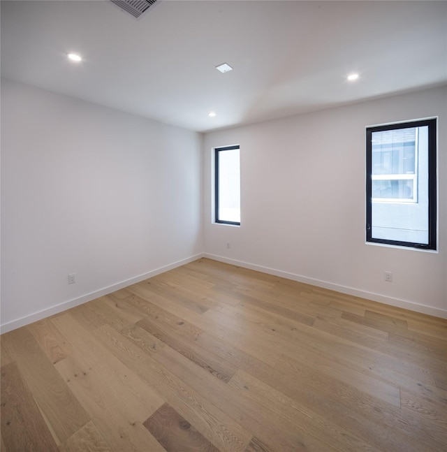 2239 Colquitt St, Houston, TX 77098 - unfurnished room featuring light wood-style floors, recessed lighting, baseboards, and visible vents