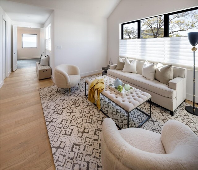 2239 Colquitt St, Houston, TX 77098 - living area featuring baseboards and light wood-type flooring