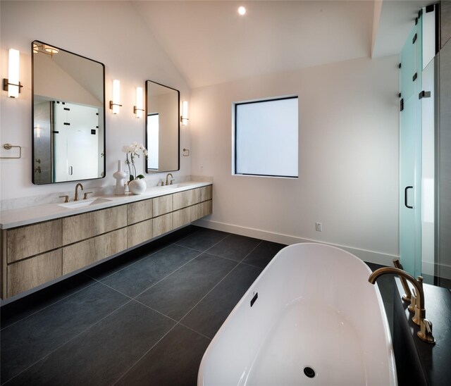 2239 Colquitt St, Houston, TX 77098 - full bath featuring double vanity, vaulted ceiling, a sink, and a soaking tub