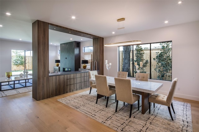 2239 Colquitt St, Houston, TX 77098 - dining area featuring recessed lighting, baseboards, and light wood-type flooring