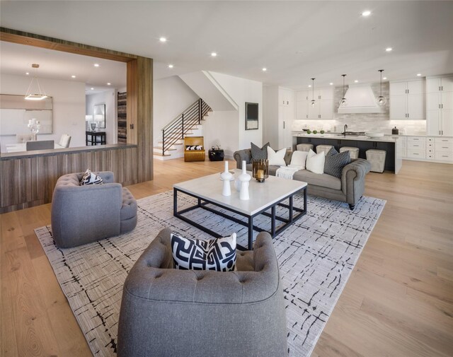 2239 Colquitt St, Houston, TX 77098 - living room featuring recessed lighting, stairs, and light wood-style flooring