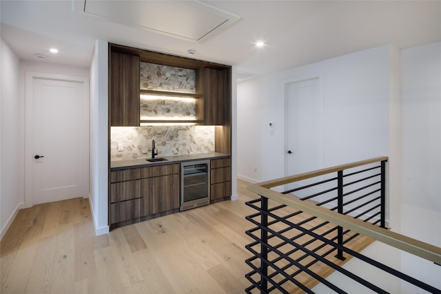 2239 Colquitt St, Houston, TX 77098 - bar featuring backsplash, wet bar, light wood finished floors, beverage cooler, and recessed lighting