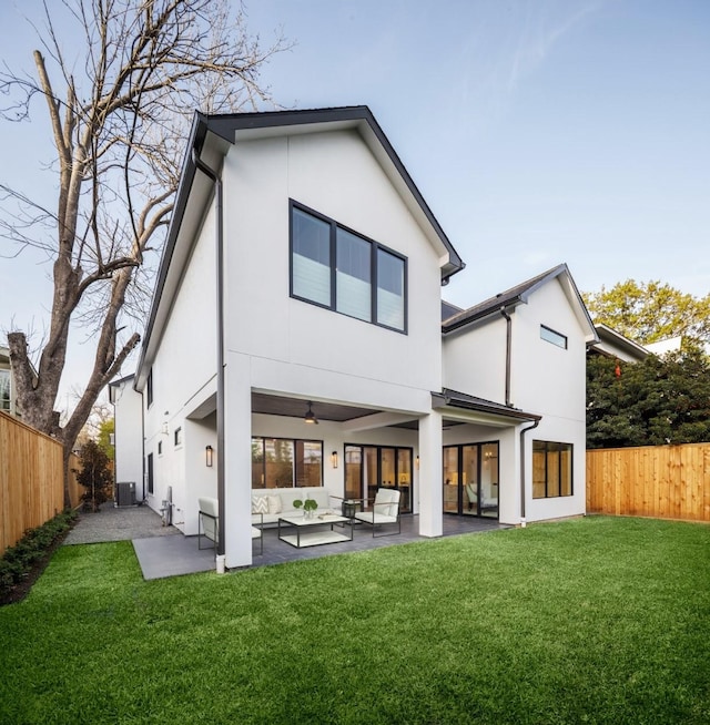 2239 Colquitt St, Houston, TX 77098 - rear view of house with a patio, a fenced backyard, stucco siding, and an outdoor hangout area