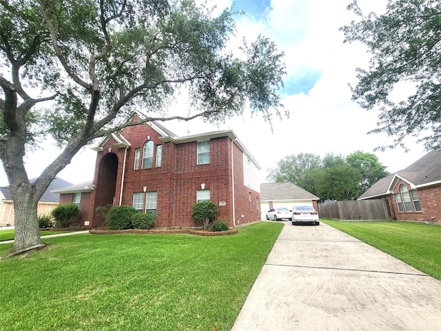 view of side of property with a yard, brick siding, fence, and a detached garage