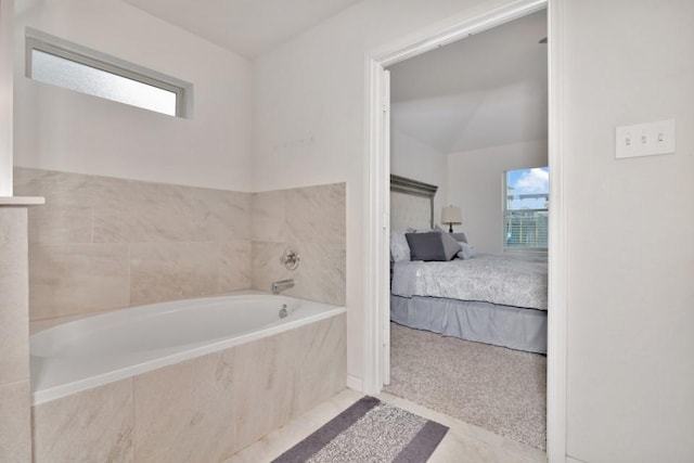 ensuite bathroom featuring ensuite bath and a garden tub