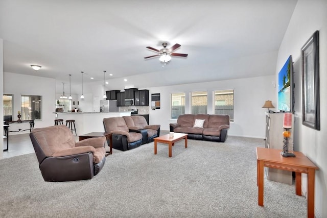 carpeted living room featuring ceiling fan
