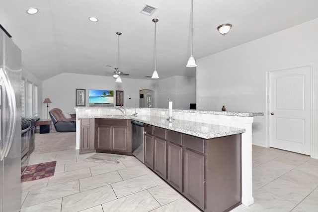kitchen featuring stainless steel appliances, vaulted ceiling, visible vents, a ceiling fan, and open floor plan