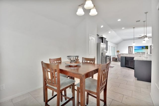dining space with lofted ceiling, recessed lighting, light tile patterned floors, and ceiling fan with notable chandelier