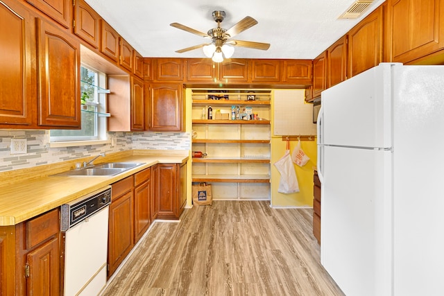 12 Walker Trl, Huntsville, TX 77320 - kitchen featuring white appliances, a sink, open shelves, light wood-type flooring, and ceiling fan