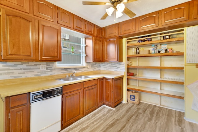 12 Walker Trl, Huntsville, TX 77320 - kitchen featuring dishwasher, decorative backsplash, light countertops, a ceiling fan, and light wood finished floors