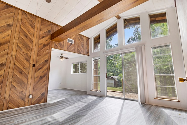 12 Walker Trl, Huntsville, TX 77320 - empty room featuring ceiling fan, wood finished floors, high vaulted ceiling, beamed ceiling, and baseboards