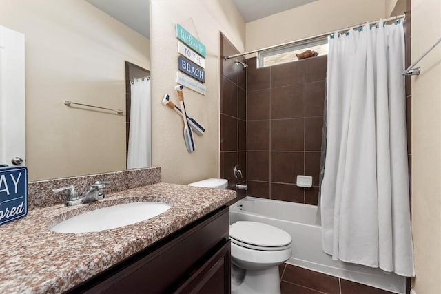 full bath with shower / tub combo with curtain, toilet, vanity, and tile patterned floors