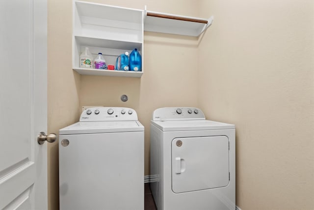 washroom with washer and clothes dryer and laundry area