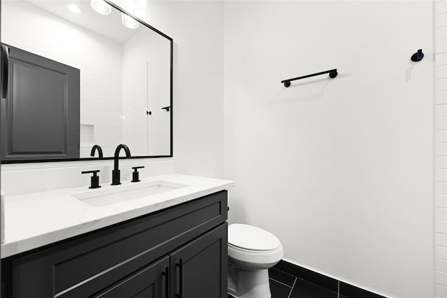 7038 Smilax St A-B, Unit A-B Houston, TX 77088 - bathroom featuring vanity, toilet, tile patterned flooring, and baseboards
