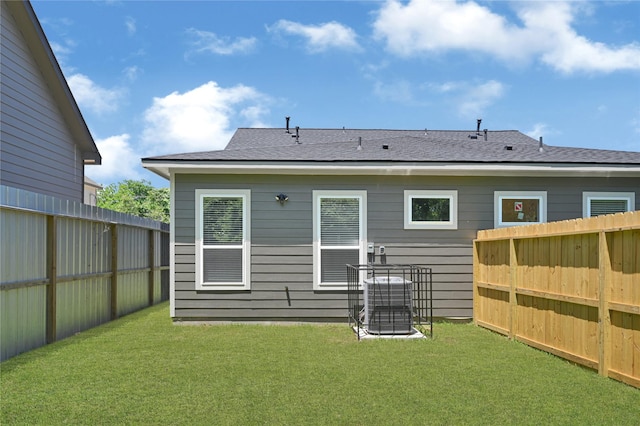 7038 Smilax St A-B, Unit A-B Houston, TX 77088 - rear view of property with central AC and roof with shingles