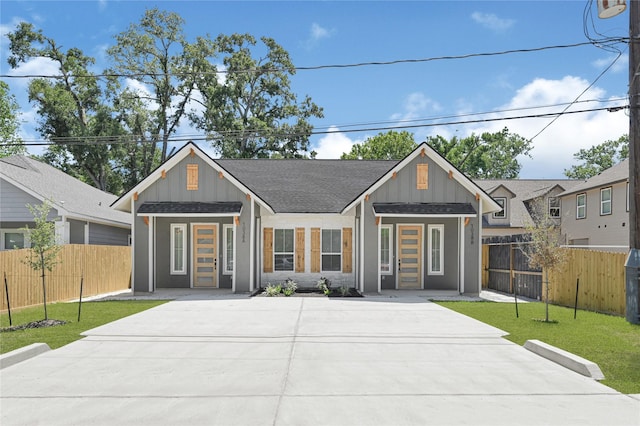 7038 Smilax St A-B, Unit A-B Houston, TX 77088 - modern farmhouse style home with board and batten siding, concrete driveway, and roof with shingles