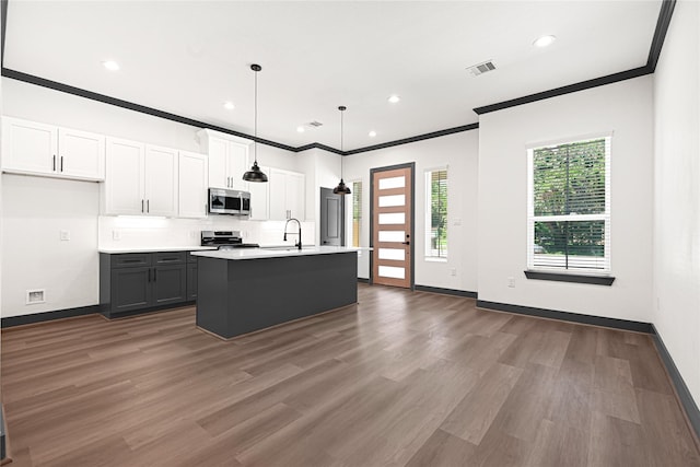 7038 Smilax St A-B, Unit A-B Houston, TX 77088 - kitchen with appliances with stainless steel finishes, ornamental molding, light countertops, backsplash, and wood finished floors