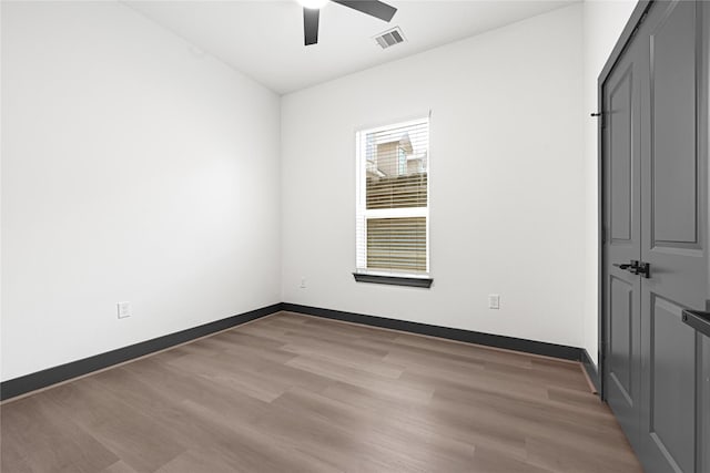 7038 Smilax St A-B, Unit A-B Houston, TX 77088 - unfurnished bedroom with light wood-style floors, baseboards, and ceiling fan
