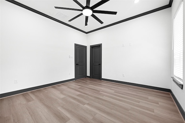 7038 Smilax St A-B, Unit A-B Houston, TX 77088 - unfurnished room with ornamental molding, ceiling fan, baseboards, light wood-style floors, and plenty of natural light