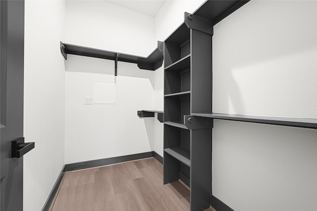 7038 Smilax St A-B, Unit A-B Houston, TX 77088 - walk in closet featuring wood finished floors