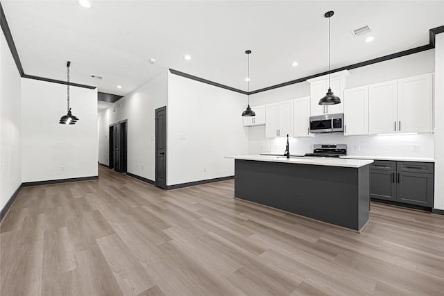 7038 Smilax St A-B, Unit A-B Houston, TX 77088 - kitchen with stainless steel microwave, range, light wood-style floors, a sink, and light countertops