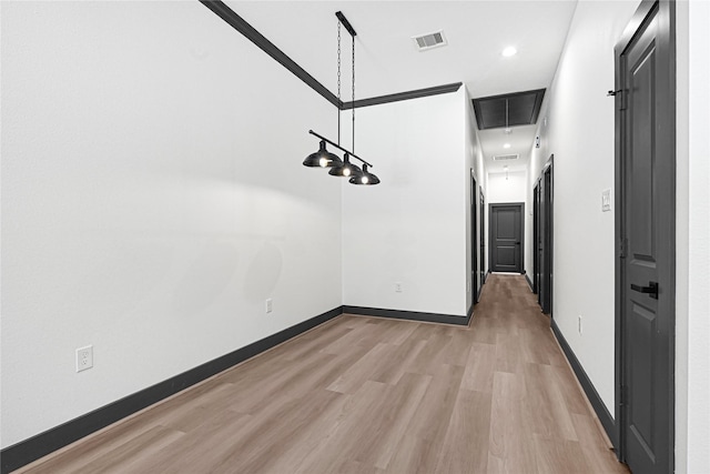 7038 Smilax St A-B, Unit A-B Houston, TX 77088 - unfurnished dining area featuring light wood-style flooring, attic access, and baseboards